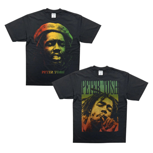 Two black short-sleeve graphic T-shirts shown on a white background, featuring a large portrait of Bob Marley with the text 'PETER TOSH' in red, yellow, and green. One shirt shows the front view and the other shows the back view.